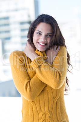 Happy woman feeling cold