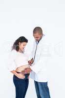 Doctor examining pregnant woman