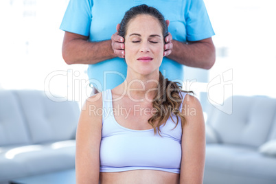 Therapist performing massage on pregnant woman