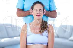 Therapist performing massage on pregnant woman