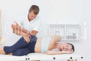 Doctor examining his patient pelvis
