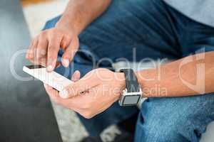 Close-up of man scrolling on phone