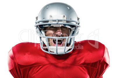 Aggressive American football player in red jersey screaming