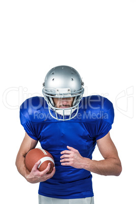 Confident sports player holding ball