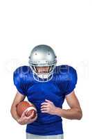 Confident sports player holding ball