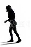 Silhouette American football player walking