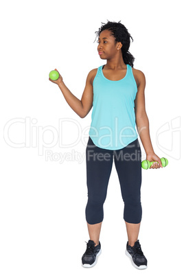 Woman exercising using dumbbells