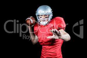 American football player throwing ball