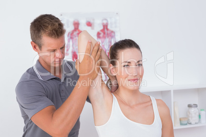 Doctor examining his patient arm