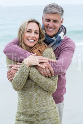 Smiling happy couple hugging each other Smiling happy couple hugging each other