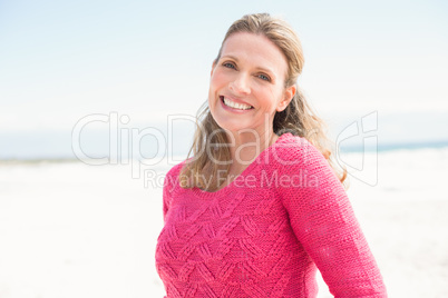 Smiling woman wearing a lovely pink top