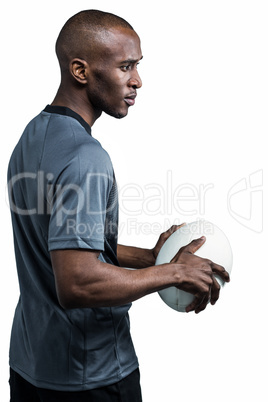 Sportsman holding rugby ball