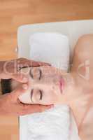 Woman receiving head massage