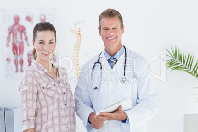 Doctor and patient looking at camera