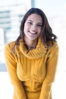 Happy brunette smiling at camera