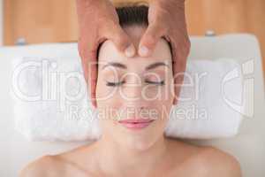 Woman receiving head massage