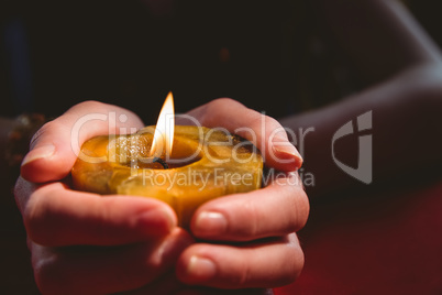 Fortune teller holding a candle