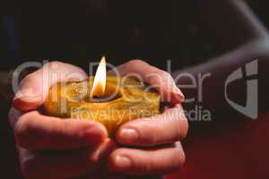 Fortune teller holding a candle