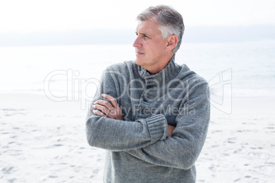 Man with crossed arms looking away