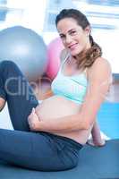 Portrait of pregnant woman in gym