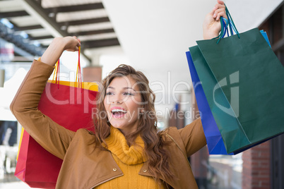 Smiling woman holding shopping bags