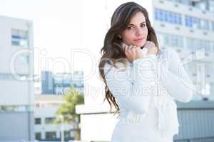 Pretty woman with warm clothes looking at camera