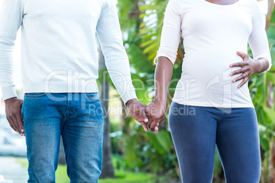 Couple holding hands while walking