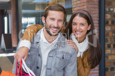 Young couple smiling while looking at the camera