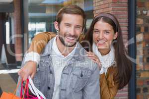 Young couple smiling while looking at the camera