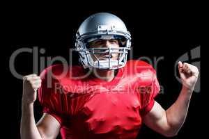 Portrait of American football player cheering with clenched fist