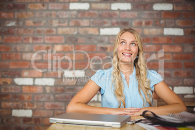 Thoughtful businesswoman in bright office