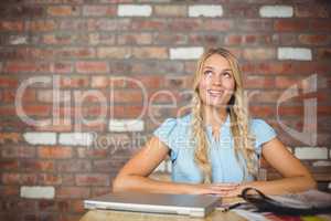 Thoughtful businesswoman in bright office