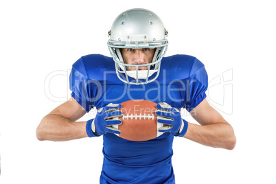 Portrait of confident sports player holding ball