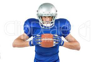 Portrait of confident sports player holding ball