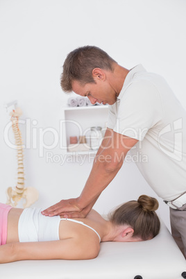 Physiotherapist doing back massage