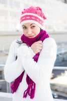 Smiling woman wearing a scarf and hat