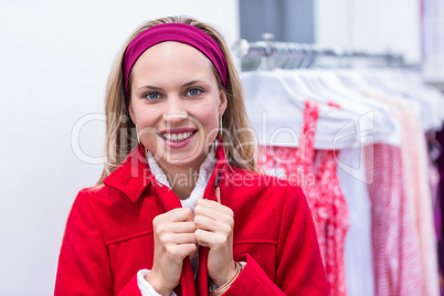 Smiling woman wearing red coat