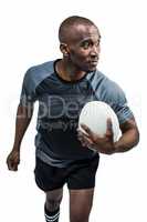 Confident athlete with rugby ball