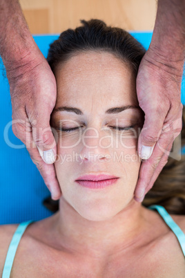 High angle view of therapist performing reiki