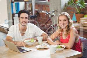 Business people with laptop in creative office