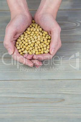 Woman showing handful of chickpeas