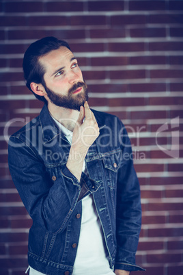 Thoughtful handsome with hand on chin man looking away