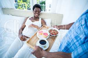 High angle view of man holding breakfast