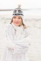 Smiling woman wearing a warm hat