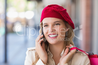 A happy smiling woman calling