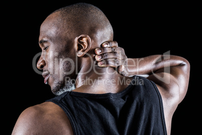 Rear view of muscular man massaging