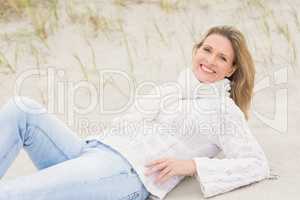 Woman lying down on the sand
