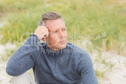 Man sitting on the sand