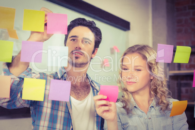 Business people standing by glass