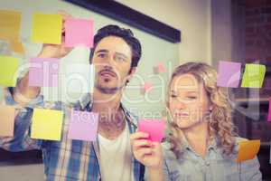 Business people standing by glass